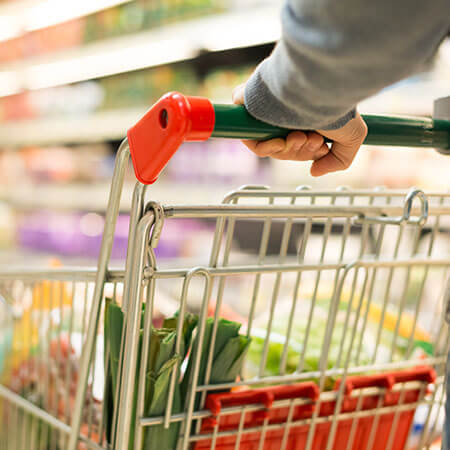 person pushing shopping trolley