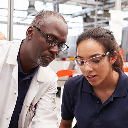 A male and female engineer with goggles on a construction site making use of their critical skills in Ireland