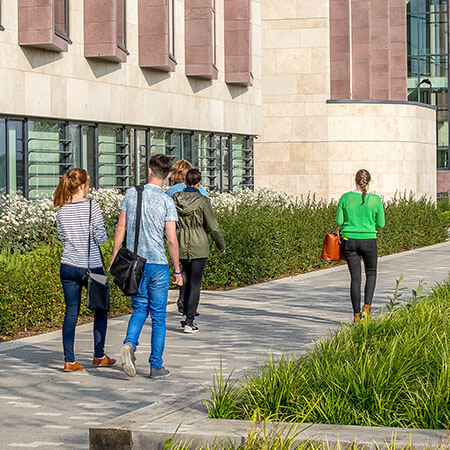 Students walking into campus