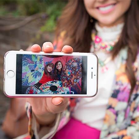 ailbhe keane holds her phone showing a photo of her sister izzy keane