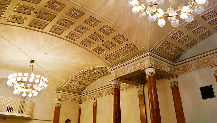 red marble pillars and ceiling tiles in gate theatre pillar room