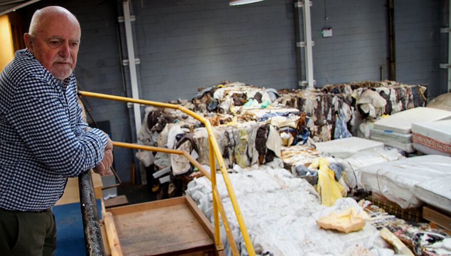 John Scally looks out over the packed warehouse floor