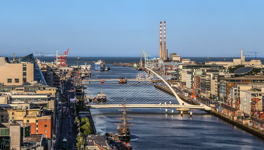 a landscape photo shows the ifsc, silicon docks and poolbeg towers in the distance