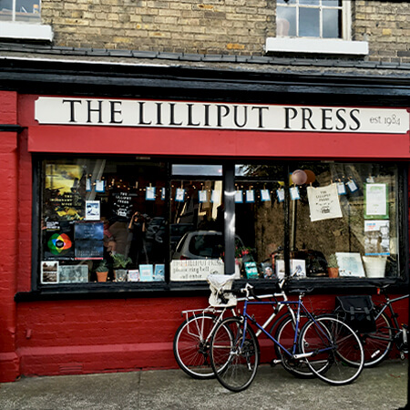 Bicycles propped against the shop window of The Lilliput Press